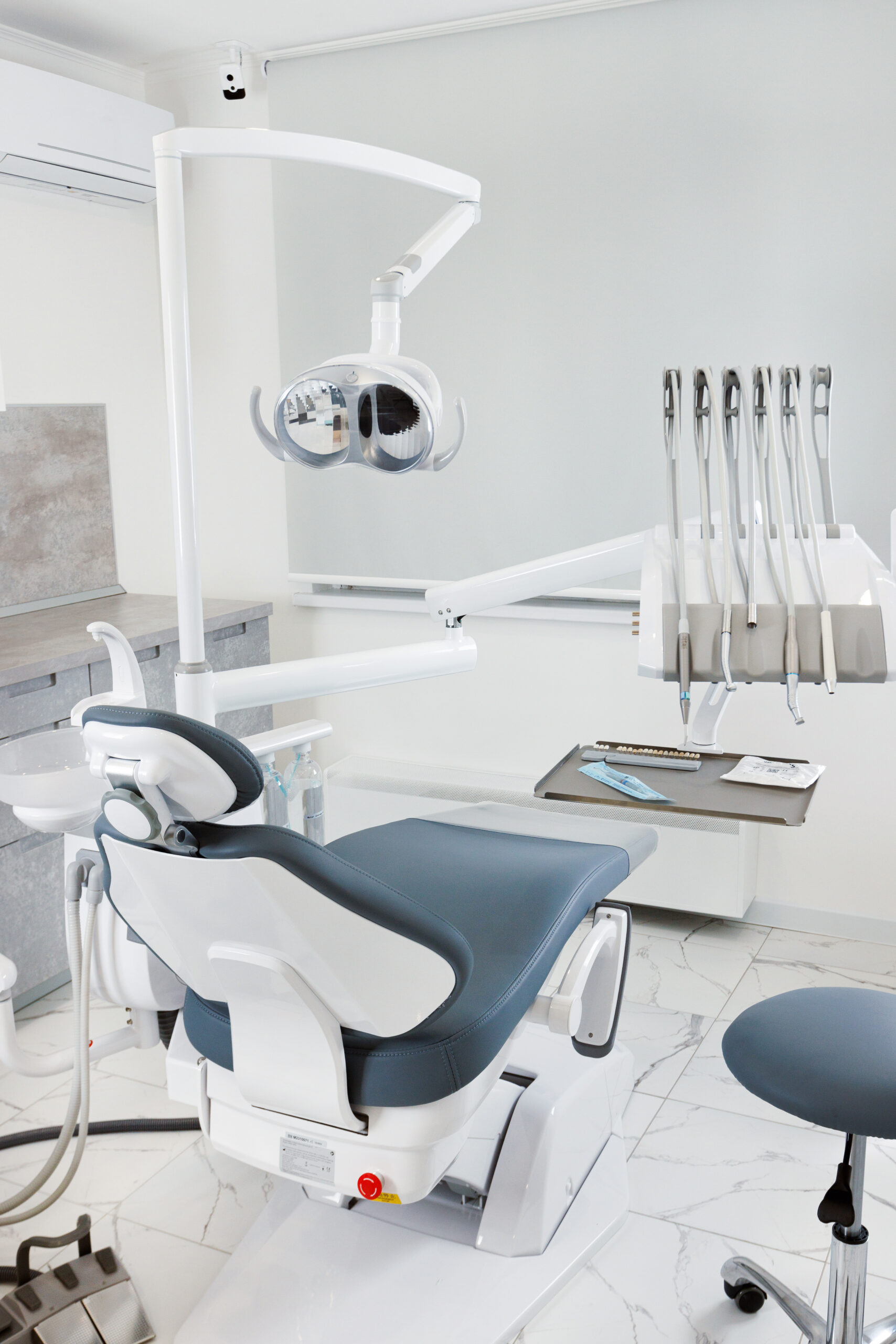 dental equipment and a chair for the patient in a bright, modern office