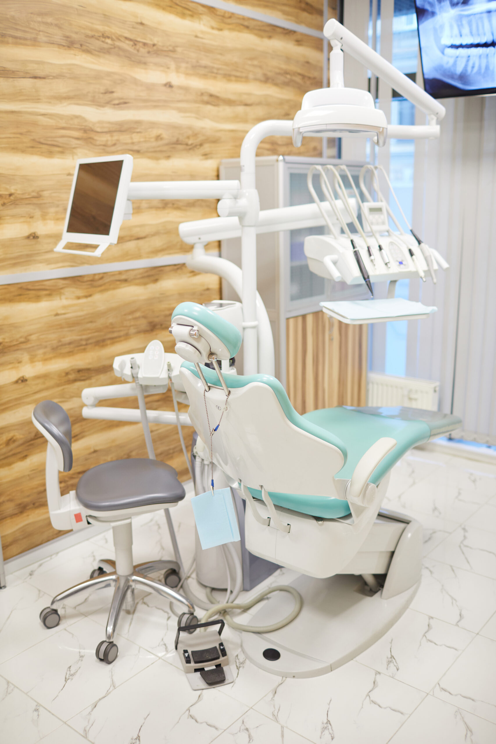 Image of chair with modern medical equipment at dental office