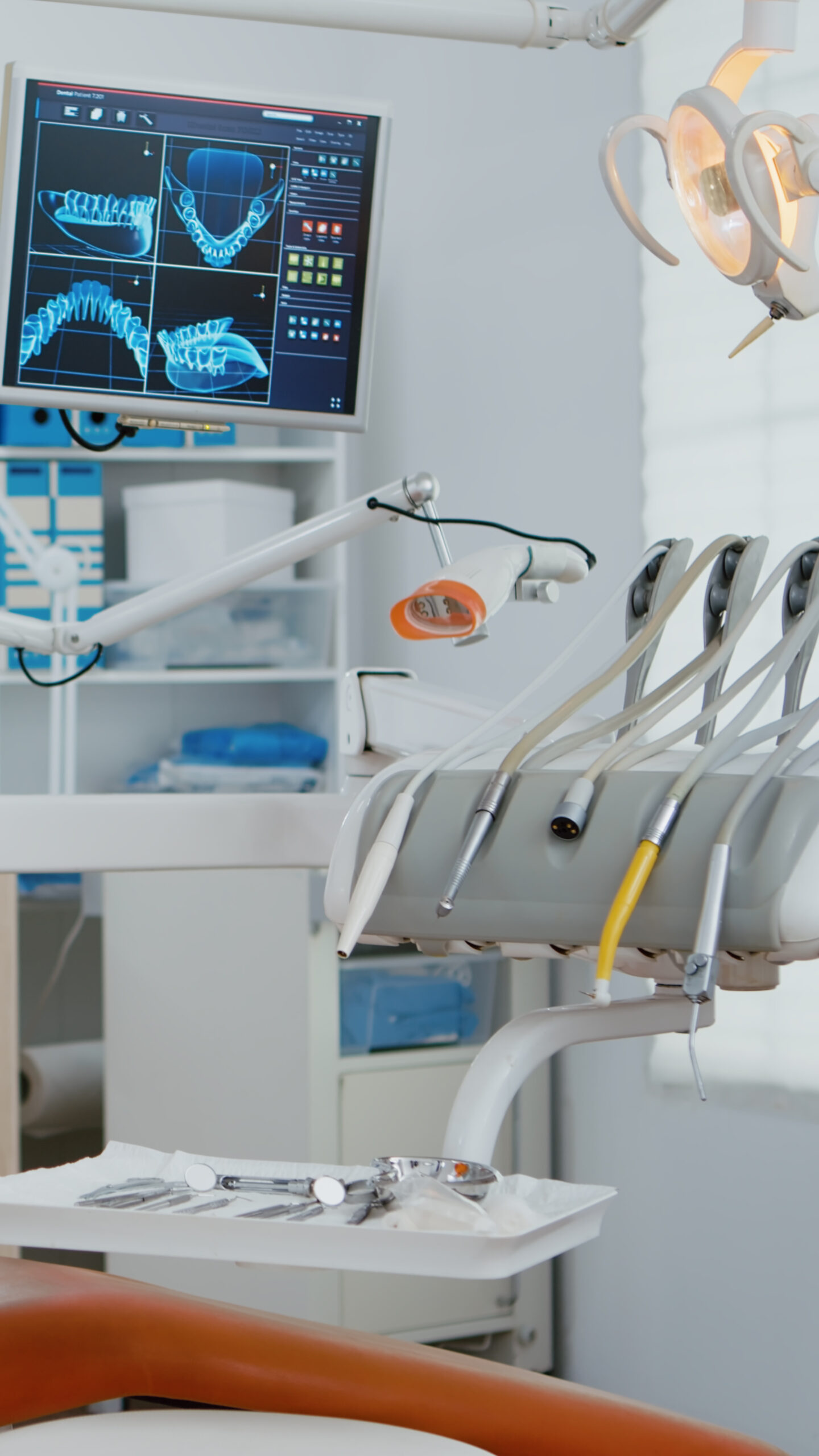 Interior of modern dental office in hospital with dentistry orthodontic furniture. Zoom in shot of professional tooth instrument. Workplace cabinet for orthodontist health, care treatment