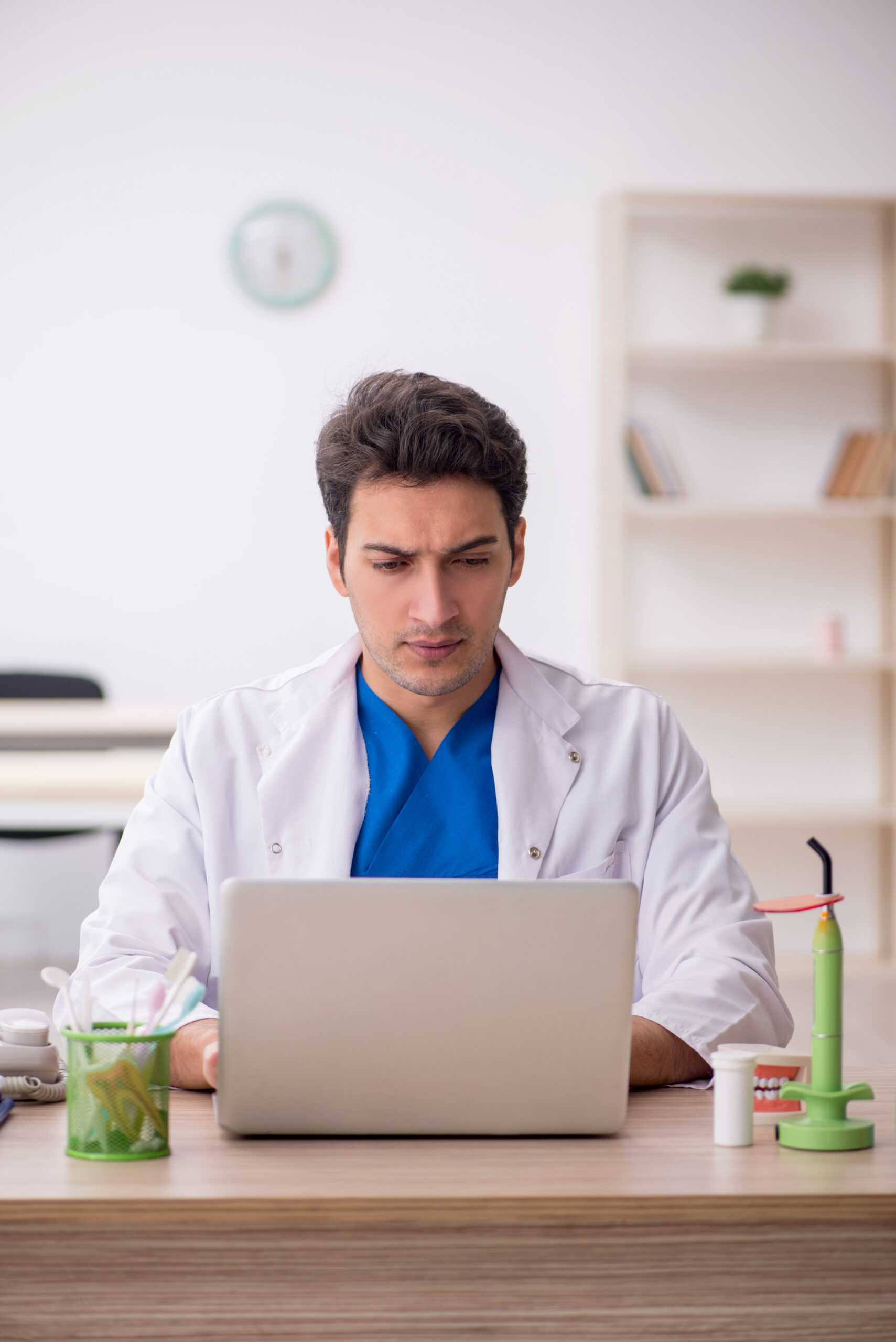 Young dentist working at the hospital